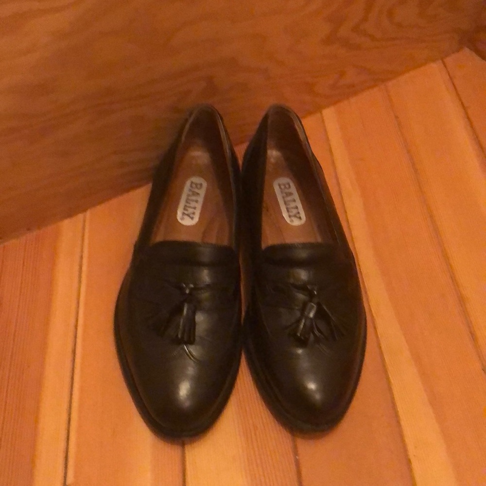 A pair of black Bally classic tassel loafers.